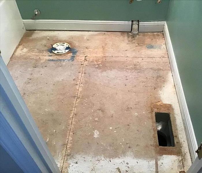 subfloors exposed and wet due to a broken pipe. 