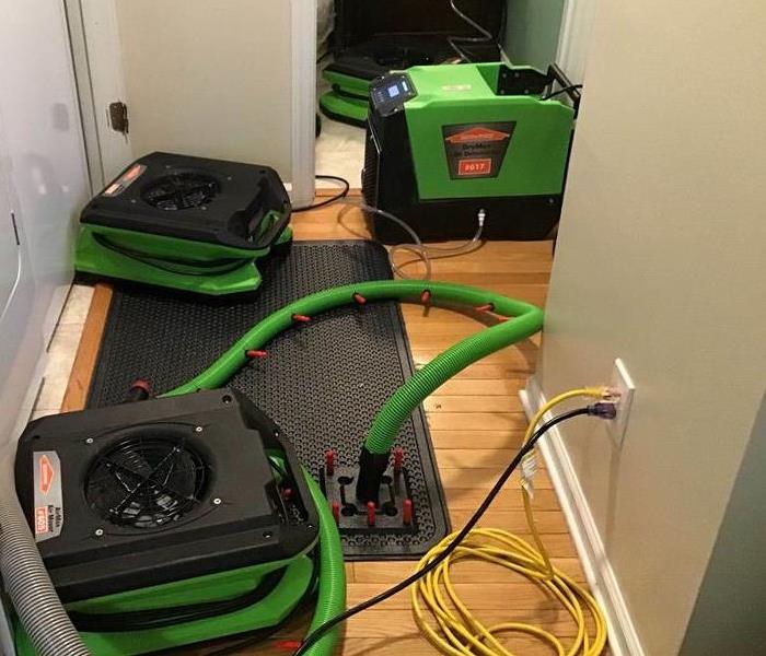 water damage caused these wood floors to need drying equipment 