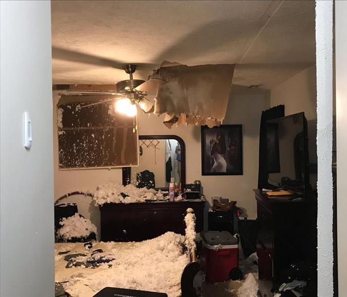 Collapsed ceiling in a bedroom.