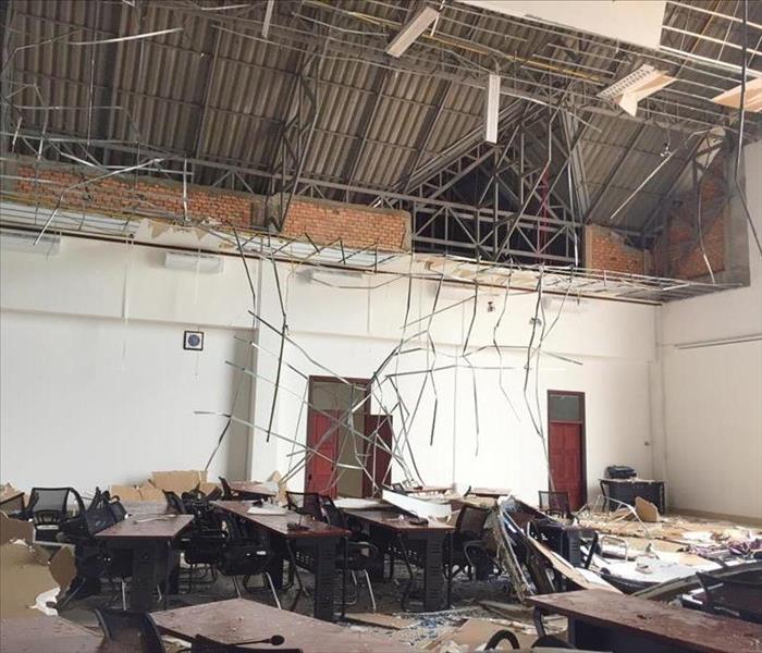 Damage to the roof and ceiling of an office following a violent storm