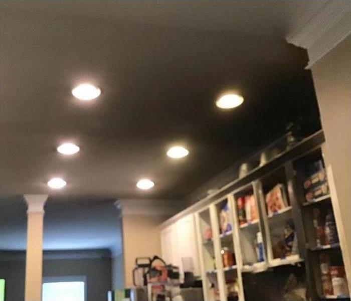 lights turned on in a kitchen ceiling, ceiling with smoke
